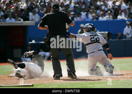 New York Yankees catcher Jorge Posada #20 prepares to put the tag