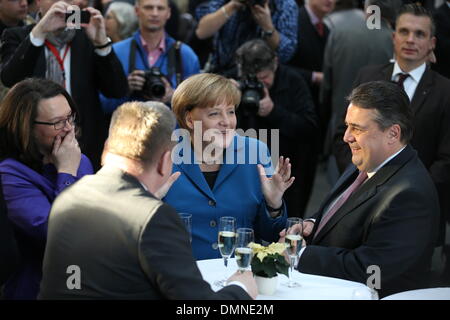 Berlin, Germany. 16th Dec, 2013. Acting German Chancellor Angela Merkel (CDU, C), designated German Vice-Chancellor Sigmar Gabriel (SPD, R), designated Minister of Labour and Social Affairs Andrea Nahles (SPD) and designated Minister of Health Hermann Groehe (CDU) stand together after the signing of the coalition agreement at the Paul-Loebe-Haus of the German 'Bundestag' parliament in Berlin, Germany, 16 December 2013. Germany will be governed by a coalition of CDU/CSU and SPD for the third time in its history. Photo: HANNIBAL HANSCHKE/dpa/Alamy Live News Stock Photo