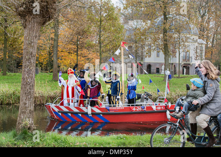 Netherlands, 's-Graveland, Festival of Sinterklaas, celebrated annually on 5 December. Arrival of Saint with Black Petes by boat Stock Photo