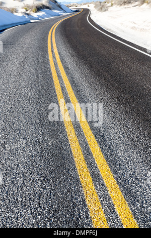 yellow dividing line on asphalt road Stock Photo