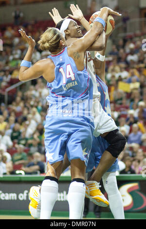 Atlanta Dream Sancho Lyttle (20) and Coco Miller (9) hug as Erika de Souza  (14) high fives during the fourth quarter against the Washington Mystics  during game 1 of the Eastern Conference