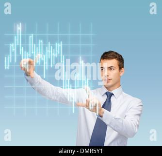 man working with forex chart on virtual screen Stock Photo