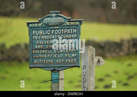 Public footpath sign showing altitude & route to Curbar, Calver, Baslow, Chatsworth and Bakewell, Peak District, Derbyshire, UK. Stock Photo