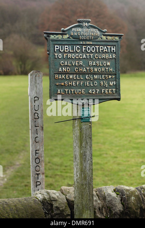 Public footpath sign showing altitude & route to Curbar, Calver, Baslow, Chatsworth and Bakewell, Peak District, Derbyshire, UK. Stock Photo