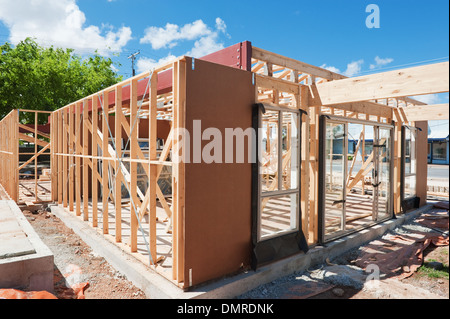 New residential construction home framing against a blue sky Stock Photo