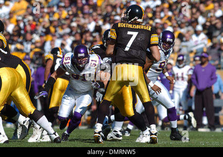 Minnesota Vikings Chad Greenway celebrates his 37 yard interception return  for a touchdown against the New York Giants in the fourth quarter with  teammates E.J. Henderson (56) and Ben Leber (51) at