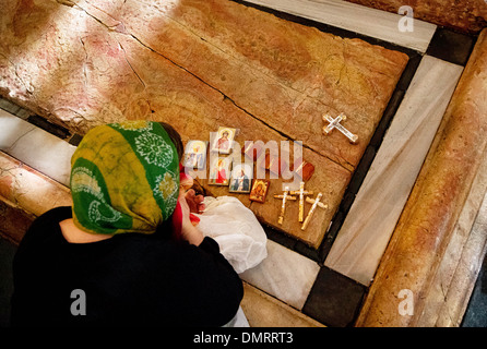 The Stone of Anointing, also known as The Stone of Unction inside the Church of the Holy Sepulchre. Stock Photo