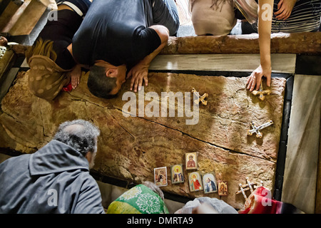 The Stone of Anointing, also known as The Stone of Unction inside the Church of the Holy Sepulchre. Stock Photo