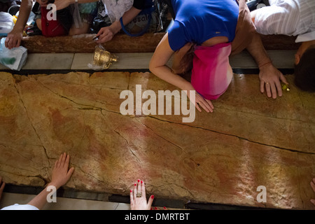 The Stone of Anointing, also known as The Stone of Unction inside the Church of the Holy Sepulchre. Stock Photo