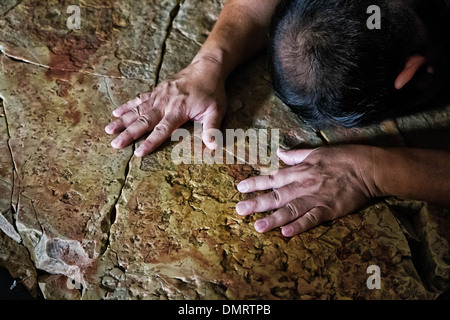 The Stone of Anointing, also known as The Stone of Unction inside the Church of the Holy Sepulchre. Stock Photo