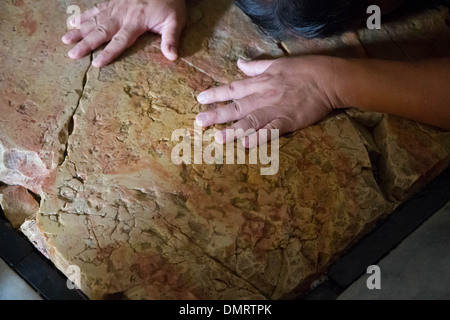 The Stone of Anointing, also known as The Stone of Unction inside the Church of the Holy Sepulchre. Stock Photo