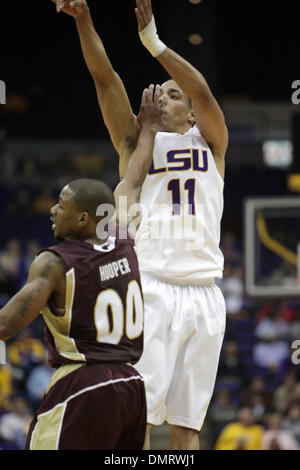 LSU guard Bo Spencer (11) shoots with the hand of a ULM defender in his face during the game between the ULM Warhawks and the LSU Tigers.  LSU won the game held at the Pete Maravich Assembly Center 82-62. (Credit Image: © Matt Lange/Southcreek Global/ZUMApress.com) Stock Photo