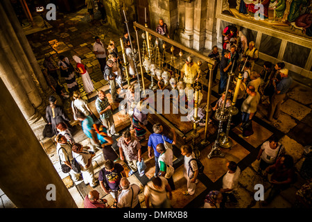 The Stone of Anointing, also known as The Stone of Unction inside the Church of the Holy Sepulchre. Stock Photo