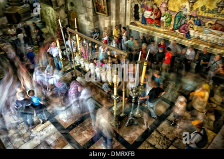 The Stone of Anointing, also known as The Stone of Unction inside the Church of the Holy Sepulchre. Stock Photo