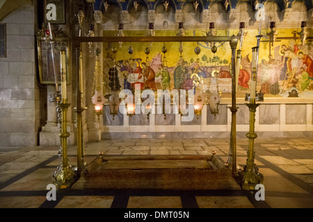 The Stone of Anointing, also known as The Stone of Unction inside the Church of the Holy Sepulchre. Stock Photo