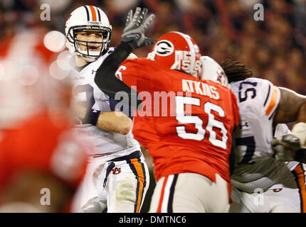 Auburn quarterback Chris Todd (12) drops back to pass under pressure at the game against Georgia in Sanford Stadium at the University of Georgia in Athens, Ga., on Saturday, November 14, 2009.  Georgia won the game 31-24. (Credit Image: © Daniel Shirey/Southcreek Global/ZUMApress.com) Stock Photo