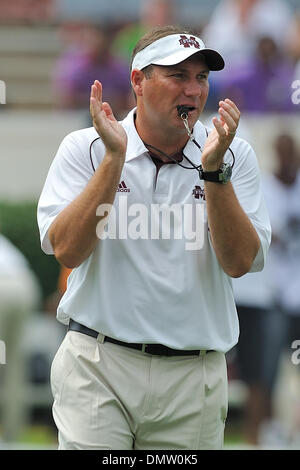 Mississippi State football coach Dan Mullen looks at his team during ...