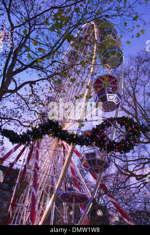 The ferris wheel at the Christmas market, Leicester Square, London, England Stock Photo