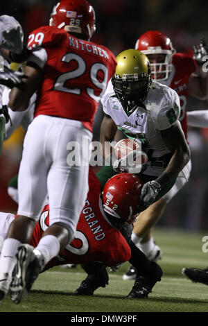 Nov. 12, 2009 - Piscataway, New Jersey, U.S - 12 November 2009; Piscataway, New Jersey:  South Florida wide receiver Dontavia Bogan #81 is tackled by Rutgers defensive end Eric Legrand #52 in game action during the second half of play of the NCAA football game between the USF Bulls and the Rutgers Scarlet Knights played at Rutgers Stadium in Piscataway, New Jersey.  Rutgers defeate Stock Photo