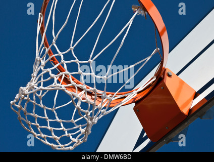 basketball rim and net placed outside on clear sky Stock Photo