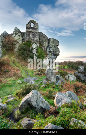 An ancient ruined chapel built in to a craggy granite tor at Roche Rock in Cornwall Stock Photo