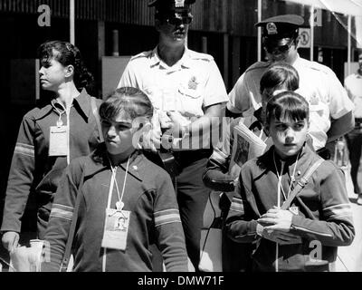 July 26, 1976 - Montreal, Canada - Gymnast NADIA COMANECI walks with her teammates and police escorts through the Olympic Village during the Montreal Olympics.   (Credit Image: © KEYSTONE Pictures USA/ZUMAPRESS.com) Stock Photo