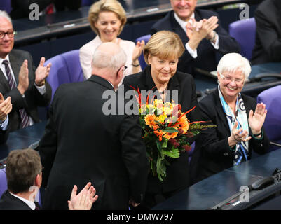 Berlin, Germany. 17th Dec, 2013. German Chancellor Angela Merkel reacts after elected during the meeting of Bundestag, lower house of parliament, in Berlin, Germany, on Dec. 17, 2013. Germany's Angela Merkel was formally elected chancellor for a third term. Credit:  Zhang Fan/Xinhua/Alamy Live News Stock Photo