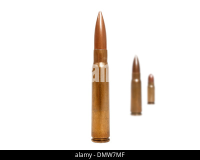 three bullets, two of them blurred deep in background Stock Photo