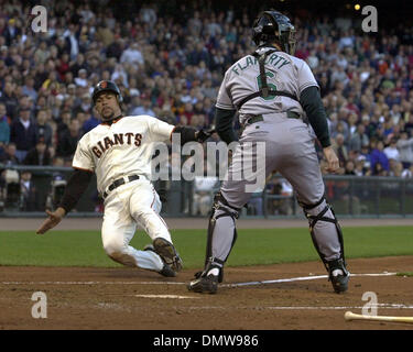 Jun 19, 2002; San Francisco, CA, USA; San Francisco Giants catcher Benito Santiago scores a run in the first inning as Tampa Bay Devil Rays catcher John Flahery waits for the ball at Pacific Bell Park in San Francisco, Calif., on Wednesday June 19, 2002. The Giants scored four runs in the inning. Stock Photo