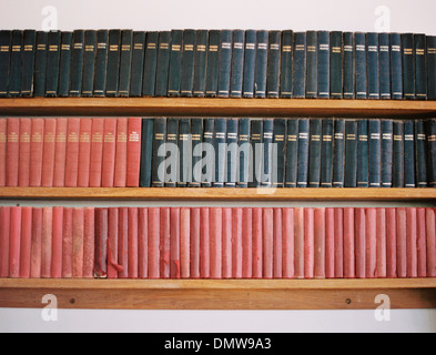 Old books on a shelf. Traditional church prayer books. Worn covers. Stock Photo