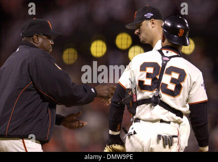 San Francisco Giants manager Dusty Baker, left, introduces, from left,  first baseman J.T. Snow, pitcher Shawn Estes, third baseman Bill Mueller,  right fielder Ellis Burks, and coach Ron Wotus during a new