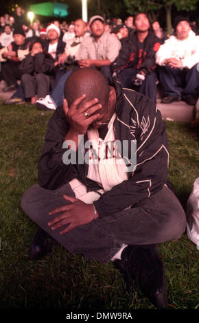 Oct 22, 2002 - San Francisco, CA, USA - 36 year Giants fan RICK JOHNSON , of San Francisco, covers his head after the Giants blow a 5 run lead and lose game 6 of the World Series. Johnson joined thousands of others gathered at Yerba Buena Gardens in San Francisco, Calif. on Saturday, October 26, 2002. (Contra Costa Times/Dean Coppola) (Credit Image: © Dean Coppola/Contra Costa Time Stock Photo