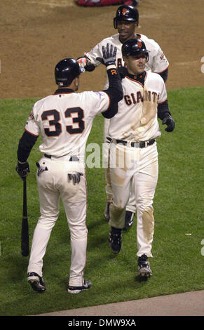 San Francisco Giant Jeff Kent rounds third, and 3rd base coach