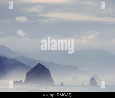 View of  Haystack Rock at Cannon Beach and  coast of  Ecola State Park Oregon. Stock Photo