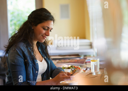 A woman using a smart phone. Stock Photo