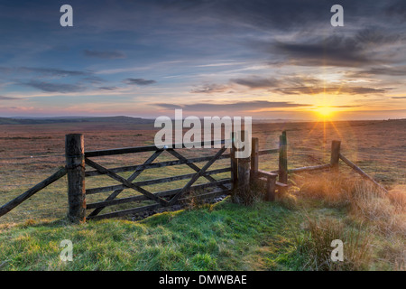 Old wooden five bar field gate and stile on windswept moorland at Bodmin Moor in Cornwall Stock Photo