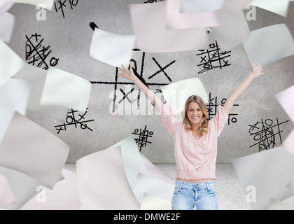 Composite image of full length shot of a smiling woman with her arms raised up Stock Photo
