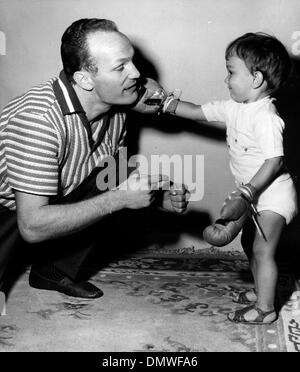 Mar. 27, 1963 - London, England, U.K. - English boxer HENRY COOPER is a champion heavyweight fighter and the only British boxer to win three Lonsdale Belts. PICTURED: Cooper at home with his son HENRY COOPER JR.  (Credit Image: © KEYSTONE Pictures USA/ZUMAPRESS.com) Stock Photo
