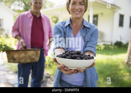 A family summer garing at a farm. A shared meal a homecoming. Stock Photo