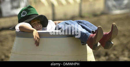 May 20, 2001; Castro Valley, CA, USA; 7-year-old Indy Nelson, of Hayward, clowns around in, where else, the rodeo clown's barrel May 20, 2001 before the Rowell Ranch Rodeo in Castro Valley, Calif.  Nelson was working in the petting zoo at the event. Stock Photo