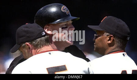 San Francisco Giants Robby Thompson, right, is congratulated by teammates  Brett Butler (2) and Will Clark (22) after Thompson hit a 2 run homer in  the seventh inning against the Chicago Cubs