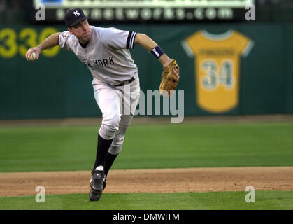 New York Yankees' third baseman Scott Brosius throws to first