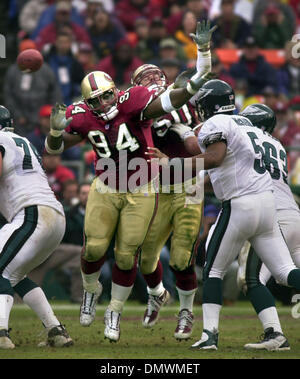 Dec 22, 2002; San Francisco, CA, USA; Dana Stubblefield #94 and Derek Smith #50 pressure Philadelphia Eagle quarterback Donovan McNabb during the 49ers victory December 22, 2001 in San Francisco. Stock Photo