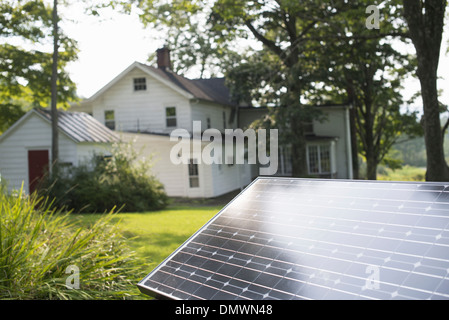 A solar panel in a farmhouse garden. Stock Photo