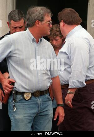 June 4, 1993 - West Memphis, AR, U.S. - June 4, 1993 - Charles Jason Baldwin, one of three teens charged in the murders of Steve Branch, Christopher Byers and Michael Moore,  is led from the West Memphis police station after arraignment Friday afternoon. West Memphis Municipal Judge William P. Rainey appointed private attorneys for the defendants and ordered them to appear in Critt Stock Photo