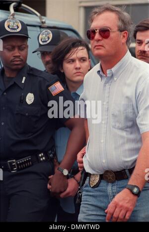 June 4, 1993 - West Memphis, AR, U.S. - June 4, 1993 - Michael Wayne ''Damien'' Echols is led from the West Memphis Police Station after arraignment in the murders of three 8-year-olds. As the closely guarded suspects Echols, Jessie Lloyd Misskelley Jr. and Charles Jason Baldwin were led from the gray-brick municipal court building at midafternoon, a crowd of 200 angry people gathe Stock Photo