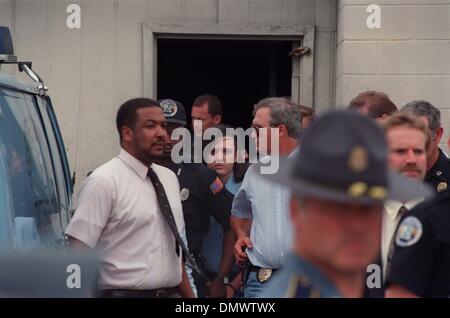 June 14, 1993 - West Memphis, AR, U.S. - June 4, 1993 - Michael Wayne ''Damien'' Echols is led from the West Memphis Police Station after arraignment in the murders of three 8-year-olds. As the closely guarded suspects Echols, Jessie Lloyd Misskelley Jr. and Charles Jason Baldwin were led from the gray-brick municipal court building at midafternoon, a crowd of 200 angry people gath Stock Photo