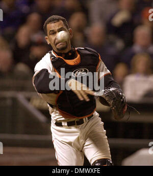 Apr 30, 2002; San Francisco, CA, USA; San Francisco Giants catcher Benito Santiago makes the throw to first to get Philadelphia Phillies  Bobby Abreu on the bunt in the 5th inning of their game at Pac Bell Park Tuesday April 30,2002. Stock Photo