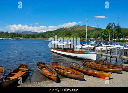 Dinghies for hire, pulled up on the beach at Waterhead, Lake Windermere, Lake District National Park, Cumbria, England UK Stock Photo