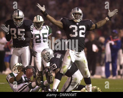 Dec 02, 2002; Oakland, CA, USA; Oakland Raiders' Charles Woodson, tackles  #28 Curtis Martin of the New York Jets'in the 4th quarter of their game on  Monday, December 2, 2002 at Network